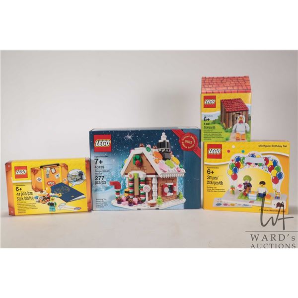Four Lego kits including "Gingerbread House" no. 40139, "Minifigure Birthday Set", 41 pce. Lego trav