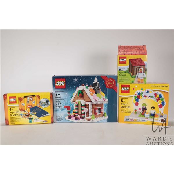 Four Lego kits including "Gingerbread House" no. 40139, "Minifigure Birthday Set", 41 pce. Lego trav