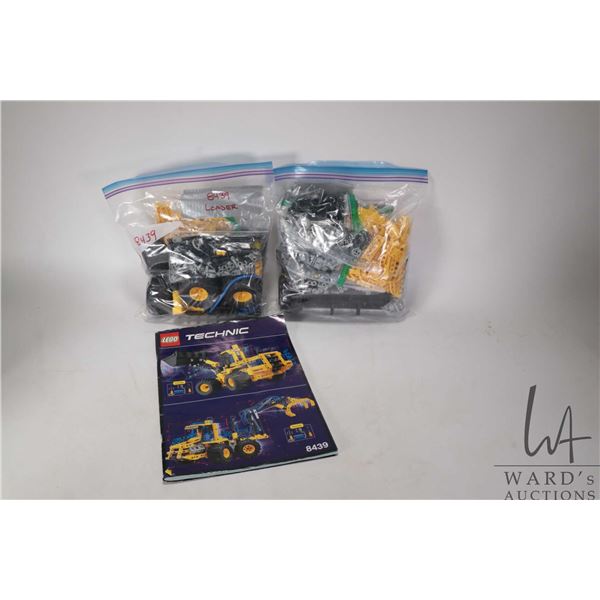 Lego-Technics "Front End Loader" and "Log Grapple" Pre-built kits. Includes building guide. Complete
