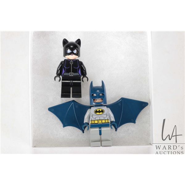 Two Lego Batman Minifigures including Batman with hard wings and Cat woman