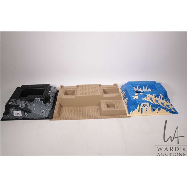 Three Lego bases including 32 X 32 Ramp and Pit with ice pattern, 32 X 32 Ramp and Pit with craters 