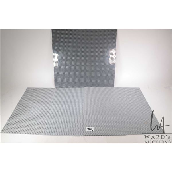Three 15" X 15" Lego baseplates and one non-Lego baseplate 15 3/4" X 15 3/4"