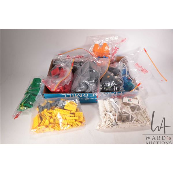 Large selection of Lego building bricks including Lego City, separated into colours