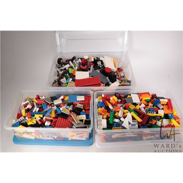 Three plastic containers of Lego building bricks