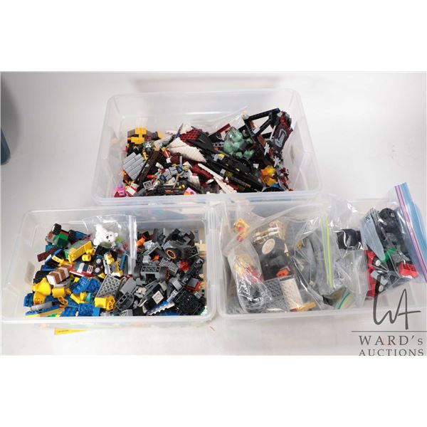 Three plastic containers of Lego building bricks
