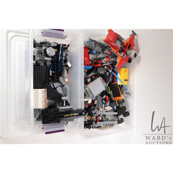 Two plastic containers of Lego building bricks