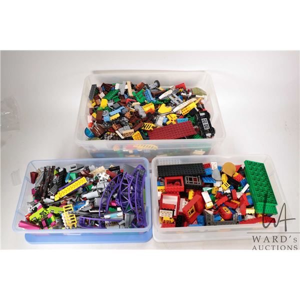Two plastic containers of Lego building bricks
