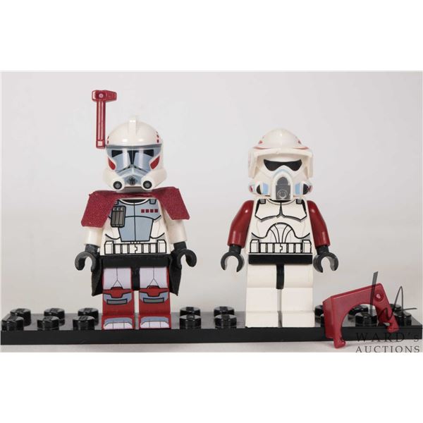 Two Lego Star Wars minifigures including Clone ARC Trooper and Clone ARF Trooper.
