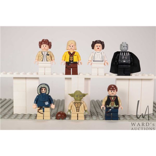 Seven Lego Star Wars minifigures including Celebrations Luke Skywalker, Celebrations Han Solo, Han S