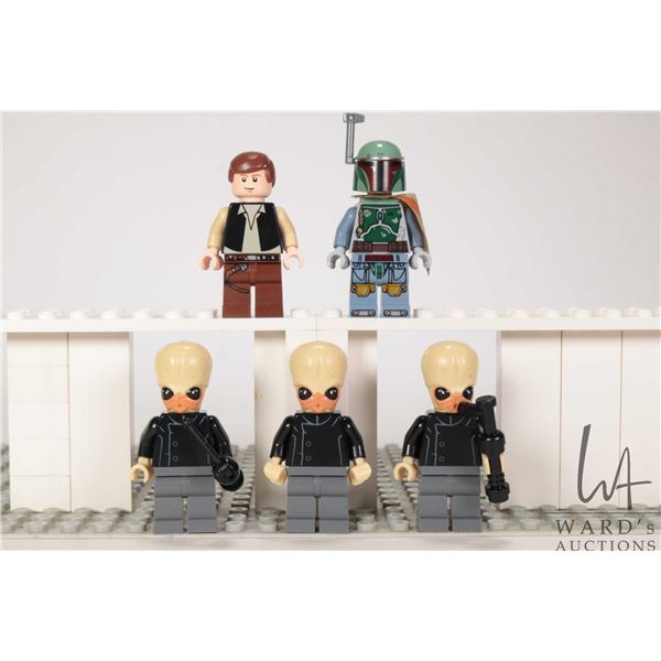 Five Lego Star Wars minifigures including 3 Bith Musicians, Han Solo, Boba Fett