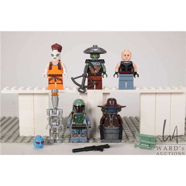 Six Lego Star Wars minifigures including Cad Bane, Embo, Boba Fett, Aurra Sing, Assassin Droid, etc.