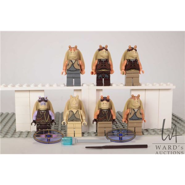 Seven Lego Star Wars minifigures including 3 Jar Jar Binks, 2 Gungan Warrior, Captain Tarpals, etc.