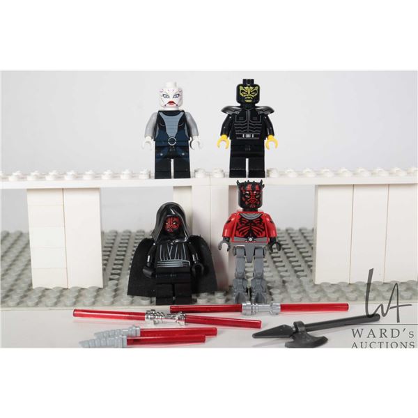 Four Lego Star Wars minifigures including Savage Opress (missing crown), Darth maul, Darth Maul Mech