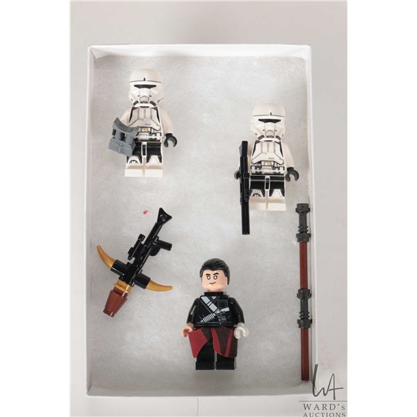 Three Lego Star Wars minifigures including Chirrut Imwe, 2 Imperial Hovertank Pilots from set 75152