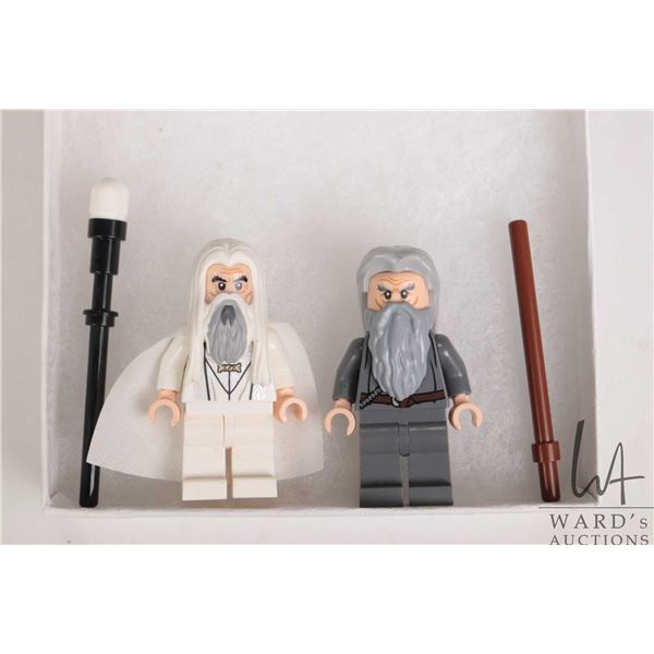 Two Lord of The Rings minifigures Saruman and Gandalf the Grey