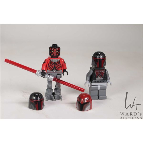 Two Lego Star Wars minifigures including Darth Maul with Mechanical legs and a Mandalorian Super Com