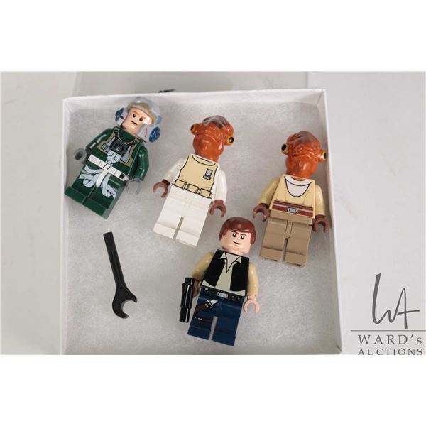 Four Lego Star wars Minigures including Han Solo, Nahdar vebb, Admiral Ackbar, and a Rebel A-Wing Pi