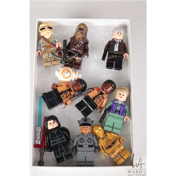Selection of Lego Star Wars minifigures including Rey, Chewbacca, Han Solo, 2 Finns, Princess Leia, 