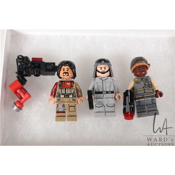 Three Lego Star Wars minifigures including Baze Malbus, Lieutenant Sefla, and Resistance Trooper.