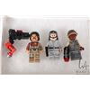 Image 1 : Three Lego Star Wars minifigures including Baze Malbus, Lieutenant Sefla, and Resistance Trooper.