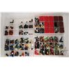 Image 1 : Four plastic containers filled with body parts and accessories for Minifigures