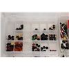 Image 5 : Four plastic containers filled with body parts and accessories for Minifigures