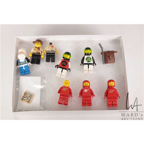 Vintage Lego minifigures including 1978 Red Spaceman w/ airtanks, Classic Space Red w/ Sticker torso