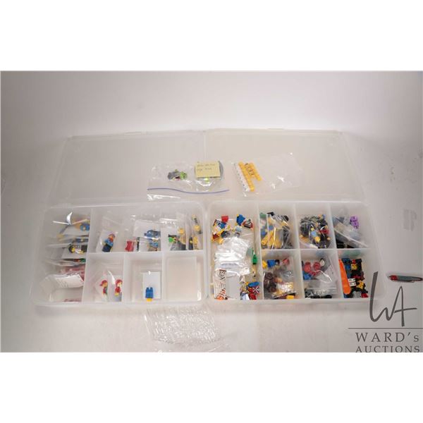Two plastic boxes containing a selection of Minifigures and Minifigure parts and accessories