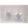 Image 1 : Two Lego Doctor Who Weeping Angels minifigures, taken apart, stored in plastic.