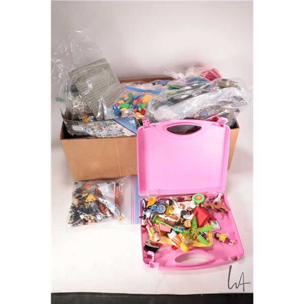 Box containing a large selection of Lego building bricks and accessories, various themes