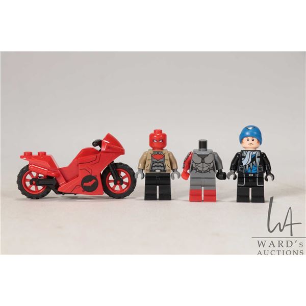 Three Lego Batman minifigures including Red Hood, Captain Boomerang, Katana torso and legs. Plus Red