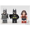 Image 1 : Three Lego Batman minifigures including Batman in armor, Batman, Wonder Woman.