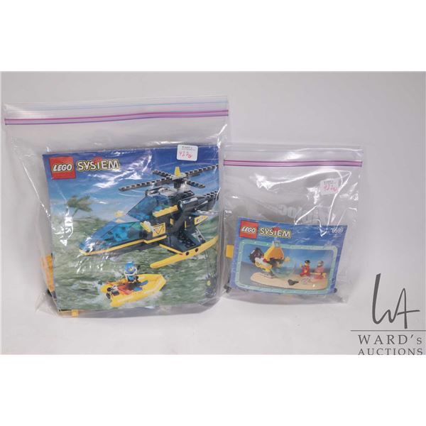 Two Lego sets including Shark Attack No. 6599 with original manual and Aerial Recovery No. 6462. Com