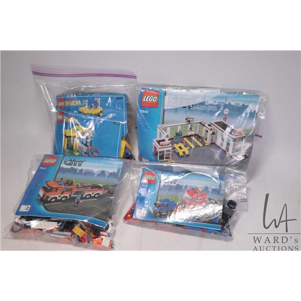 Two Lego sets including Super Cycle Center No. 6426 with original manuals, and Garage No. 7642 with 