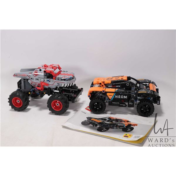Two prebuilt Lego sets including Monster Jam ThunderROARus Pull-Back No. 42200 and NEOM Mclaren Extr
