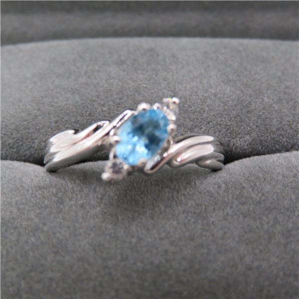 925 ring with light blue stone.  Ring is dark grey tone.  So pretty!  Approx size 7.  Marked 925