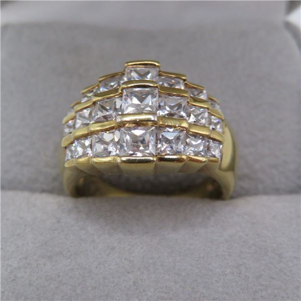 925 ring with clear stones.  Ring is gold tone.  Super bright and shiny!  Approx size 6.  Marked 925