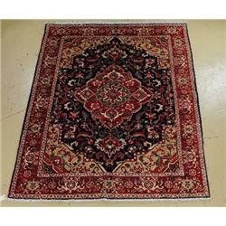 A Persian Colourful Heriz Wool Rug.