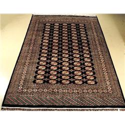 A Pakistani Bokhara Wool Rug.