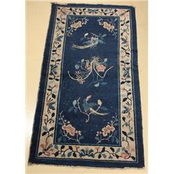 An Antique Chinese Peking Wool Rug.