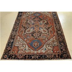 An Antique Persian Serapi Wool Rug.