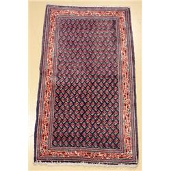 A Persian Mir Sarouk Wool Rug.