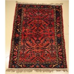 An Antique Persian Lilihan Wool Rug.