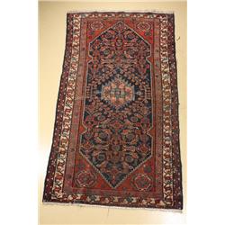 An Antique Persian Hamadan Wool Rug.