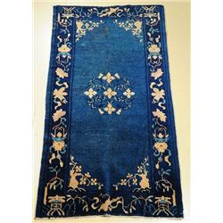 An Antique Chinese Peking Wool Rug.