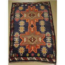 An Antique Turkish Lesgi Wool Rug.