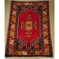 An Antique Turkish Oushak Wool Rug.