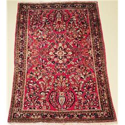 An Antique Persian Sarouk Wool Rug.