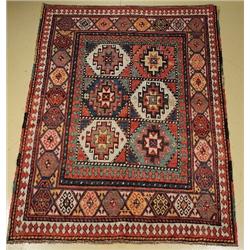 An Antique Geudge Caucasian Wool Rug.