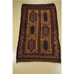 An Antique Persian Baluch Wool Rug.